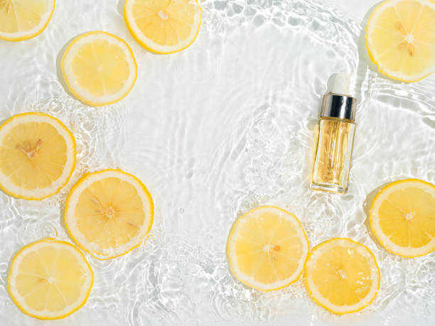 istock Cosmetic bottle in water, lemon slices, white bg 1434387651