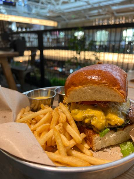 istock hamburger and fries in a cafe 1434389036