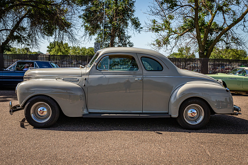 Falcon Heights, MN - June 19, 2022: High perspective side view of a 1940 Plymouth Deluxe P10 Coupe at a local car show.
