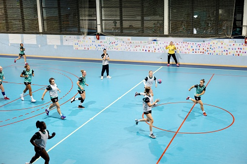 Female handball players are playing a match at training