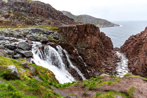 picturesque waterfall in teriberka on the kola peninsula, russia - russia river landscape mountain range imagens e fotografias de stock