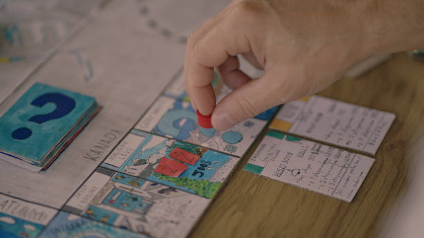 istock Human hand moving the pieces on a game board 1434394179
