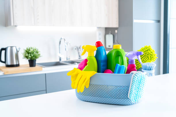 istock Cleaning equipment in a basket on kitchen counter. Copy space 1434398199