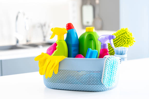 istock Cleaning concepts: basket full of cleaning products and tools on kitchen counter 1434398256