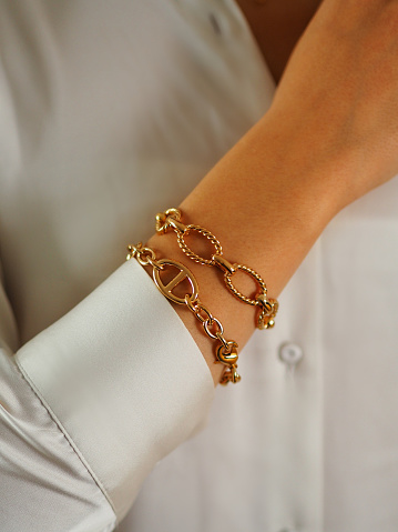 Gold bracelet on a woman wrist