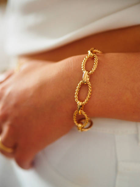 istock Gold bracelet on a woman wrist 1434399218