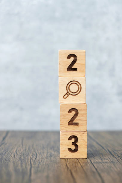 2023 block with magnifying glass icon. SEO, Search Engine Optimization, hiring , Advertising, Idea, Strategy, marketing, Keyword, Content and New Year start concepts