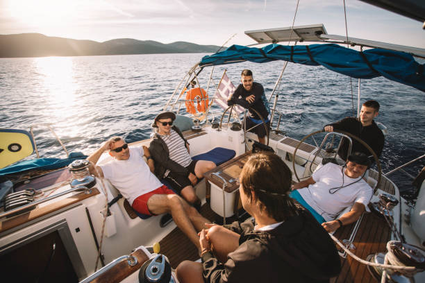 istock Group of friends from different generations enjoy sailboat ride 1434400148