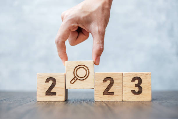 istock 2023 block with magnifying glass icon. SEO, Search Engine Optimization, hiring , Advertising, Idea, Strategy, marketing, Keyword, Content and New Year start concepts 1434400159