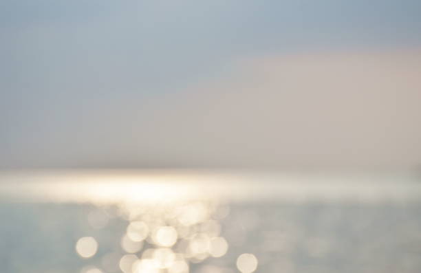 istock blurry sea with reflection of sun on sunny day background and texture 1434403100