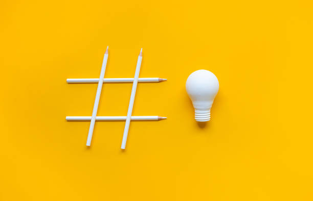 Social media and creativity concepts with Hashtag sign made of pencil and lightbulb. stock photo