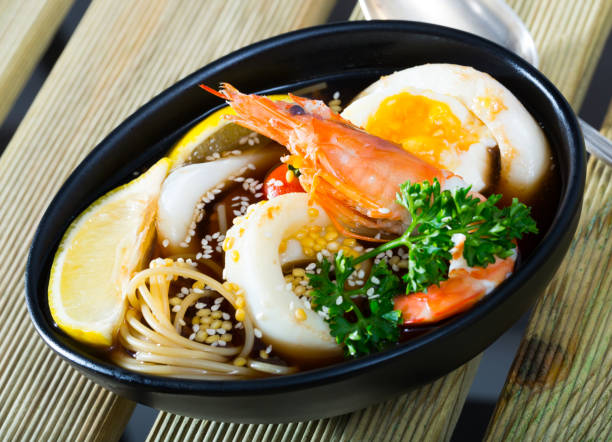 istock Spicy pan-Asian soup boiled with squid, shrimp, egg noodles 1434403845