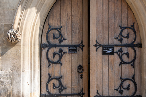 Trinity College doorway in the historic university town of Cambridge, England, UK.