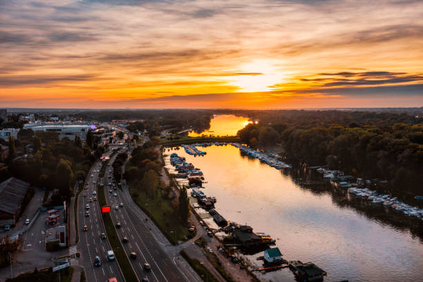 Dramatic sunset at the sky above the river and city