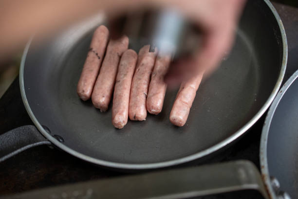 istock Sausages cooking in pan. Outdoor grilling. 1434410831