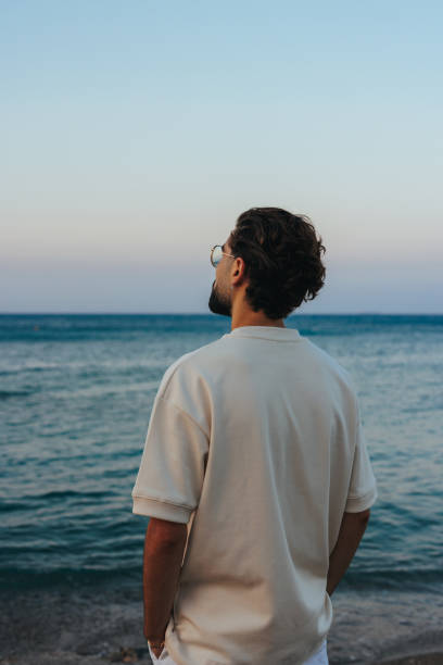 istock Young man enjoying sea view 1434411033