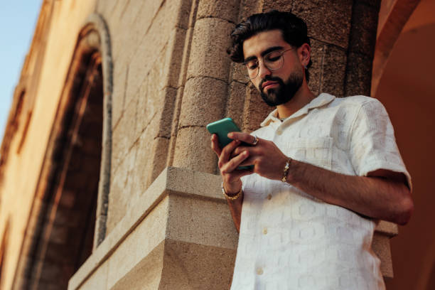 istock Man on antique street with smartphone 1434411038