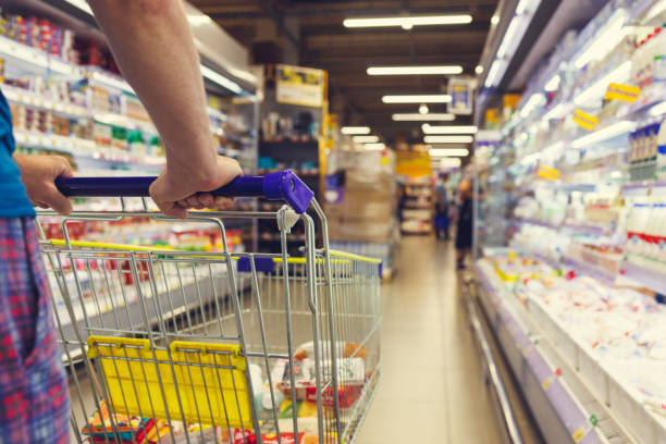 istock Man with a basket walks in a supermarket. 1434412957