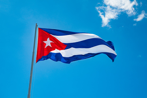 Flag of Cuba on pole in the wind.