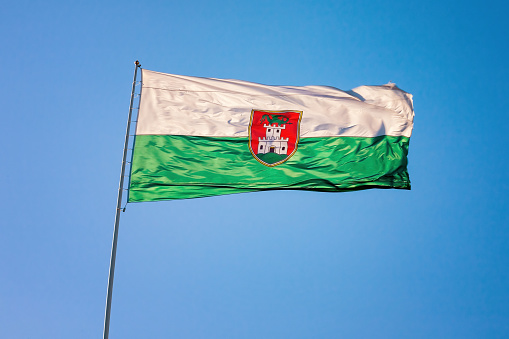 Ljubljana city flag in the wind on Ljubljana castle.