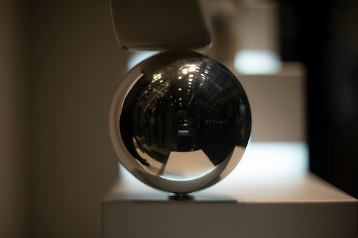 Steel ball. Metal sphere. Interior details. Shiny item.
