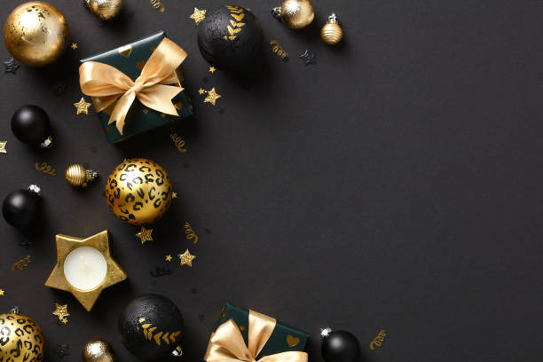 istock Luxury Christmas gift boxes and decorations on black background. Christmas greeting card template, banner mockup, cover 1434419986