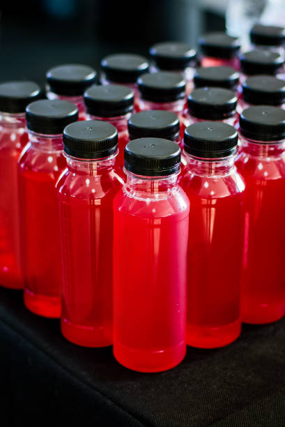 istock Catering drinks bottles with juice on the black background. 1434420848