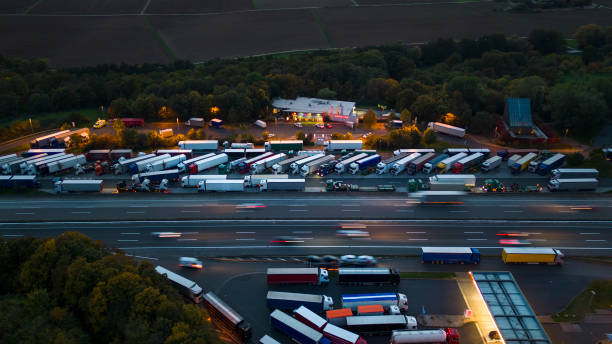 istock Highway and rest area at dusk - aerial view 1434423271