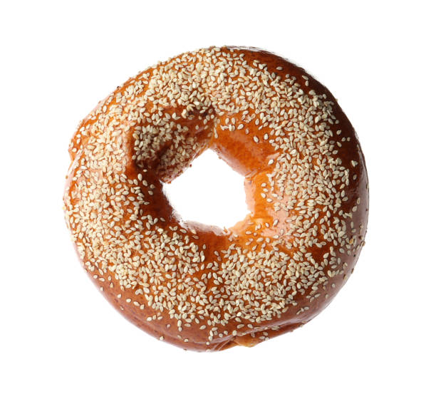 istock Delicious fresh bagel with sesame seeds isolated on white 1434424563