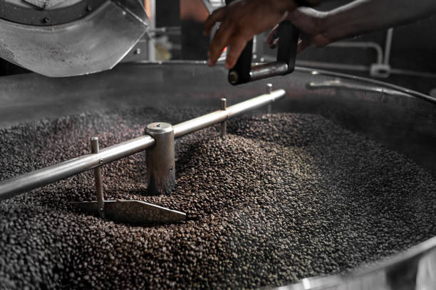 istock An Hispanic man is using a lever to release the coffee beans from the roaster machine 1434424720