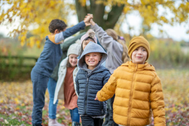 istock Playing London Bridges in the Fall Leaves 1434426413