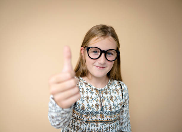 istock cool schoolgirl with black glasses 1434426442