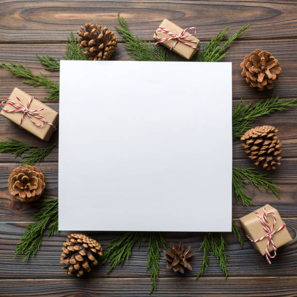 istock Flat lay Christmas composition. square Paper blank, pine tree branches, christmas decorations on Colored background. Top view, copy space for text 1434427211