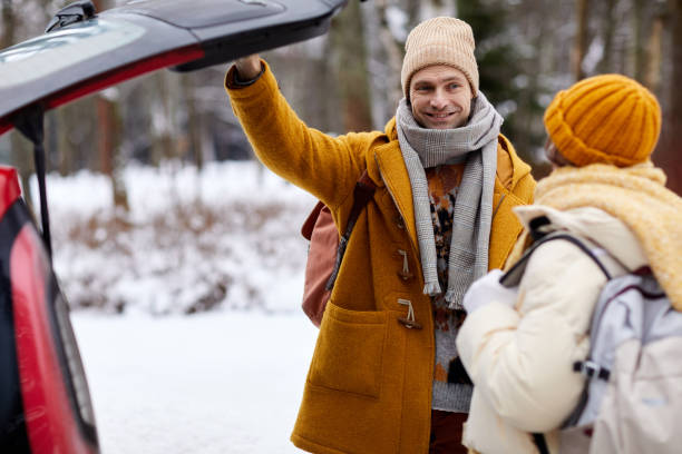 istock Couple Travelling By Car in Winter 1434428864