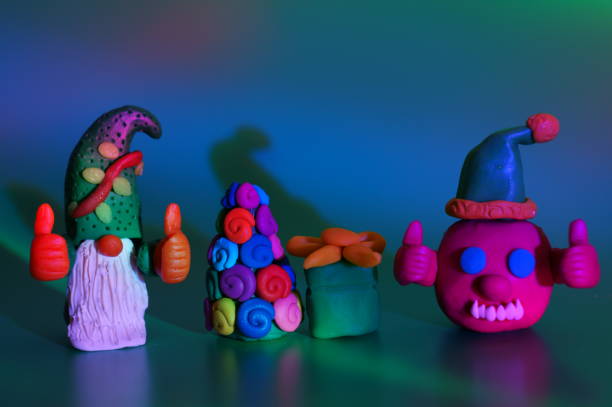 istock A virus figurine in a festive hat with thumbs up. 1434429309