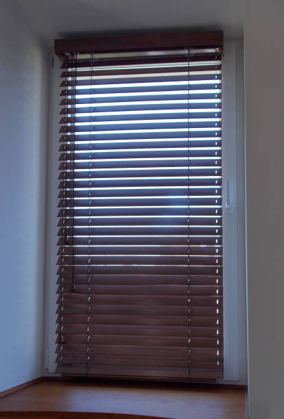 istock Wood blinds brown color closeup on the window 1434432761