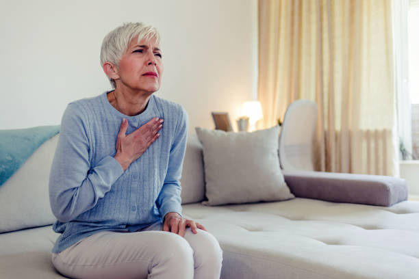 istock Female with chest pain. 1434434859