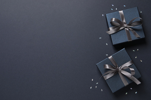 Large gift boxes with a bow on a red background