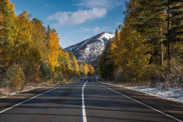 istock road asphalt mountains trees snow autumn 1434435091
