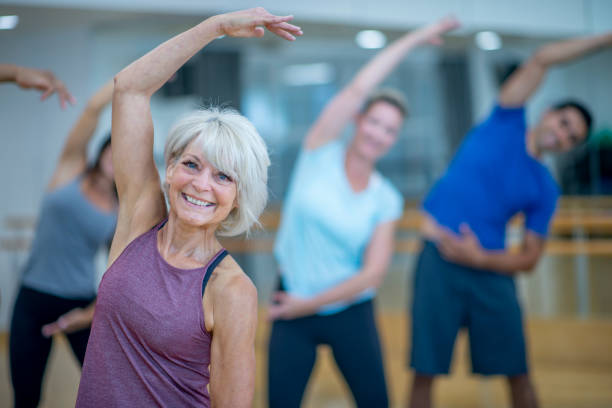 istock Stretching in a Fitness Class 1434437103