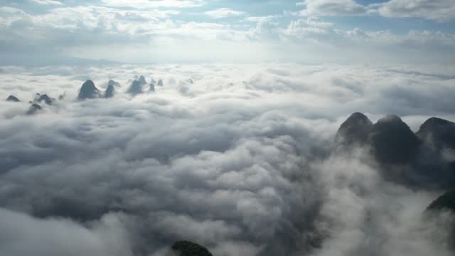 Aerial zoom in of great landscape at foggy day, Yangshuo Country, Guilin