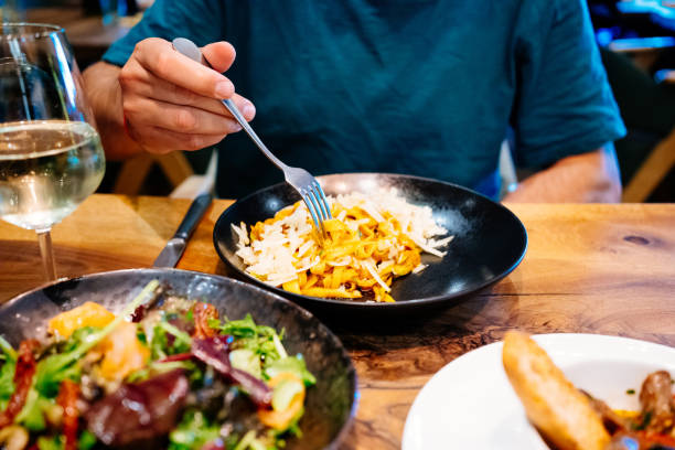 istock Young man enjoying tasty lunch. 1434438081