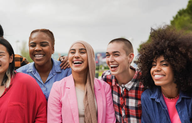 group of multiethnic girls having fun in the city - diversity and friendship concept - life events laughing women latin american and hispanic ethnicity imagens e fotografias de stock