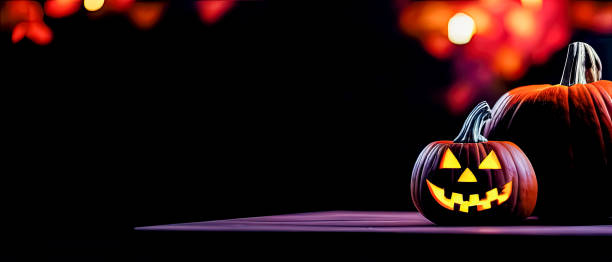 istock Cut out Halloween Pumpkin glowing at night with blurry lights in dark background 1434442800