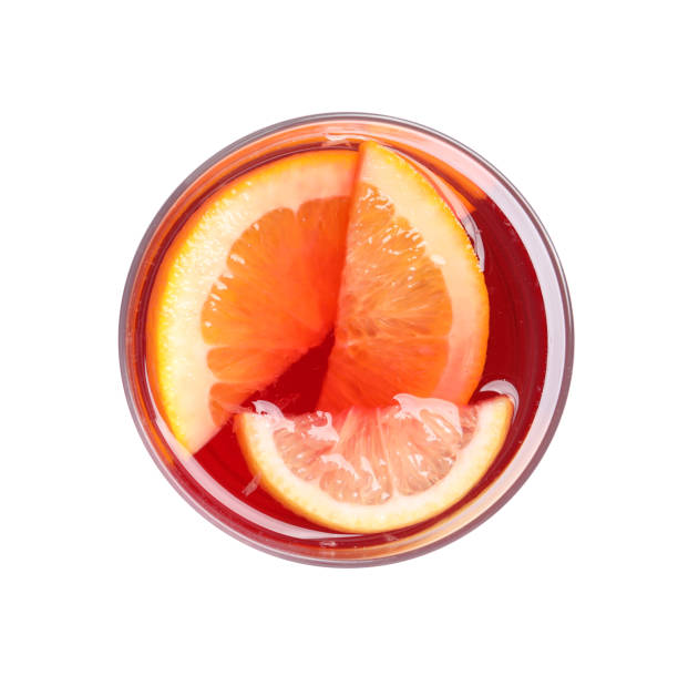 istock Glass of aromatic punch drink isolated on white, top view 1434445735