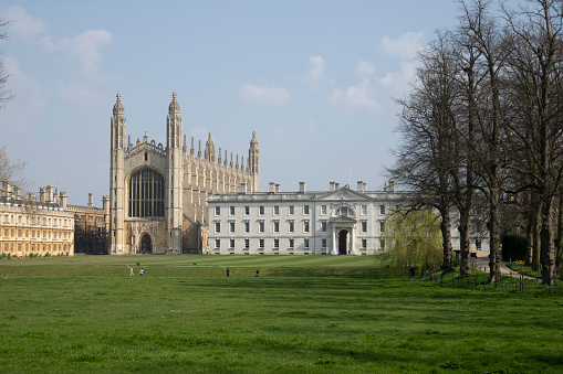 Kings College Chapel viewed through trees in springtime in the historic university town of Cambridge, England, UK.