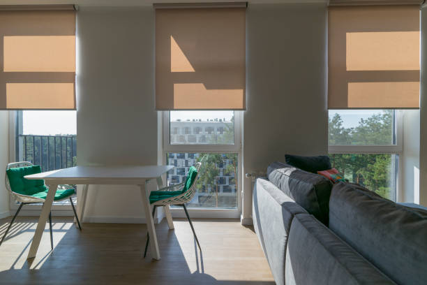 istock Roller shades automatic on large windows to the floor in the interior 1434449320