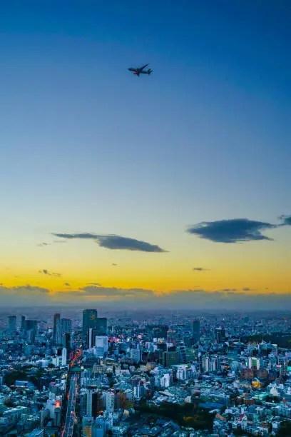 A plane flying over Tokyo (Haneda new flight route). Shooting Location: Tokyo metropolitan area