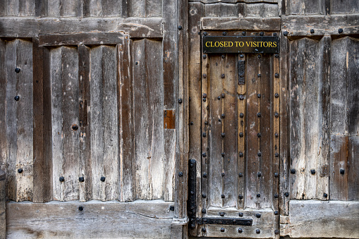 Old oak wooden doorway on a Cambridge University College.
