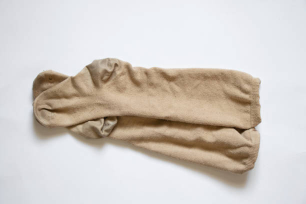 istock dirty brown womens long socks on white background, socks 1434450900